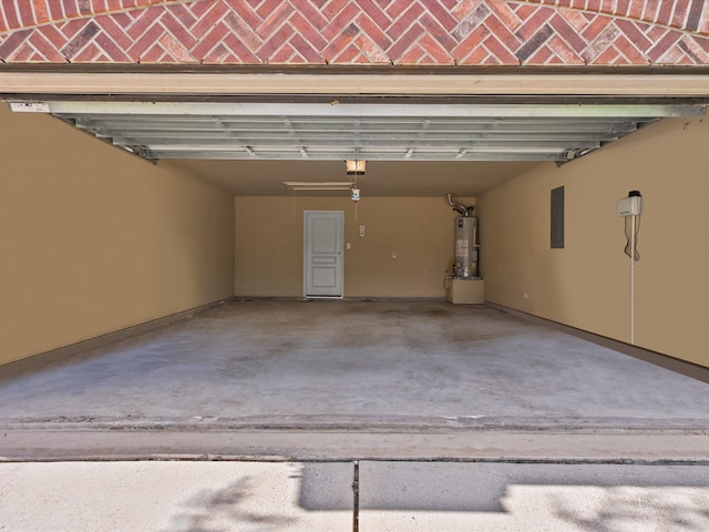 garage with electric panel and water heater