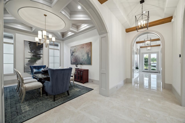 dining area featuring beamed ceiling, a chandelier, crown molding, coffered ceiling, and french doors