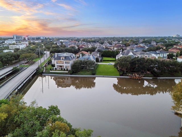 aerial view at dusk with a water view