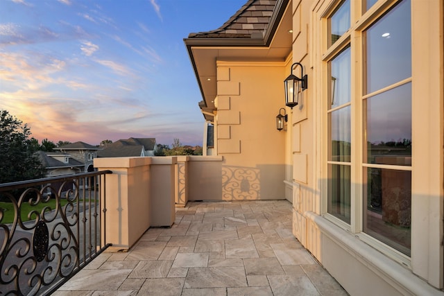 view of balcony at dusk