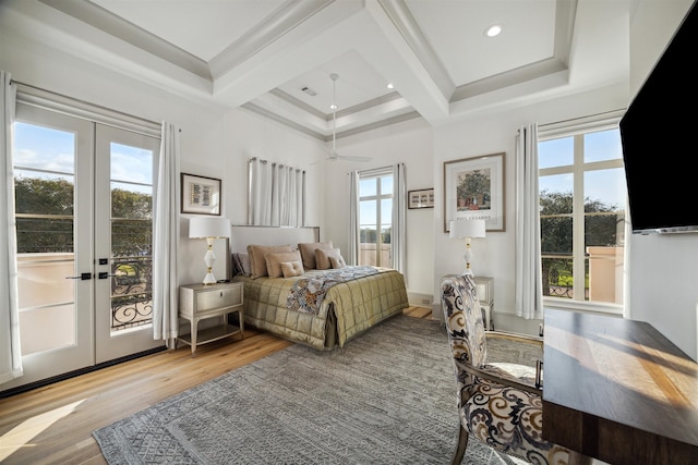 bedroom featuring access to outside, french doors, beam ceiling, and light hardwood / wood-style flooring