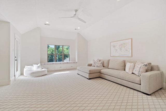 living room with lofted ceiling, light carpet, and ceiling fan