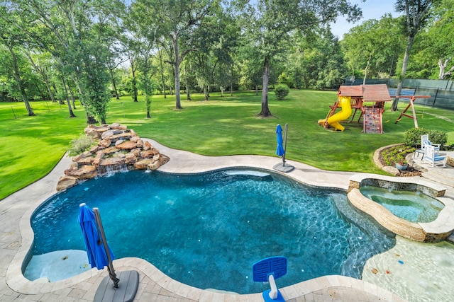 view of pool featuring a yard, an in ground hot tub, and a playground