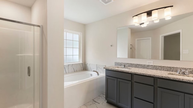 bathroom with vanity and separate shower and tub