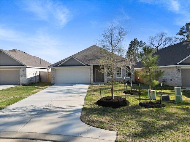 view of front of property featuring brick siding, an attached garage, concrete driveway, and a front lawn