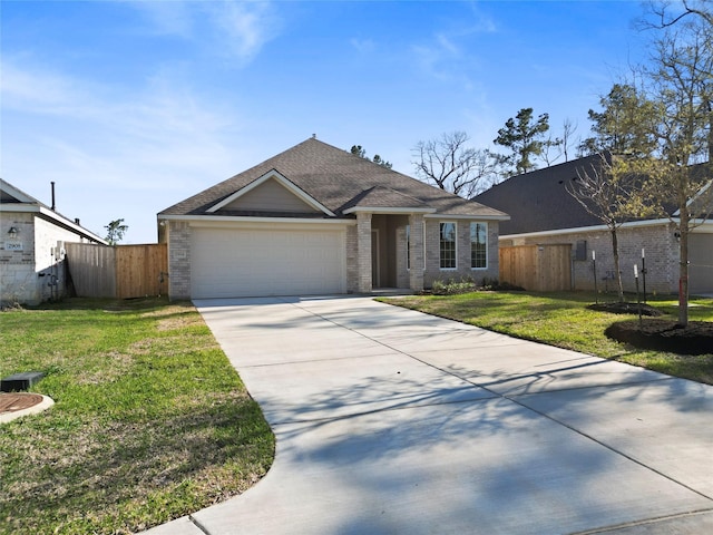 ranch-style house featuring an attached garage, fence, brick siding, and driveway