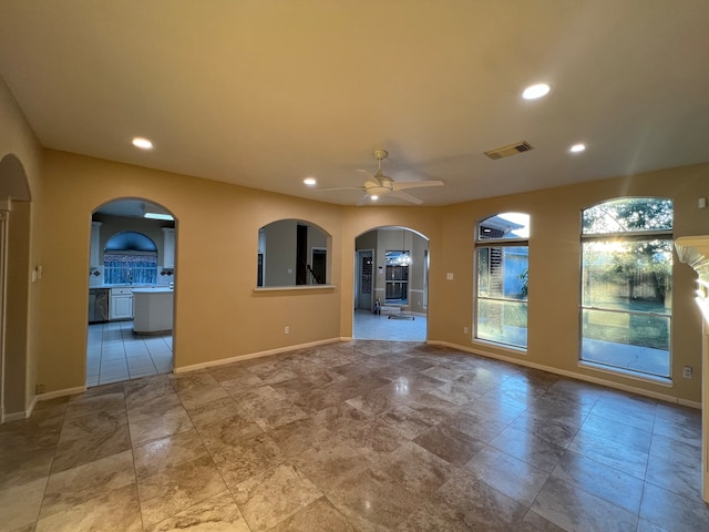 unfurnished room featuring ceiling fan