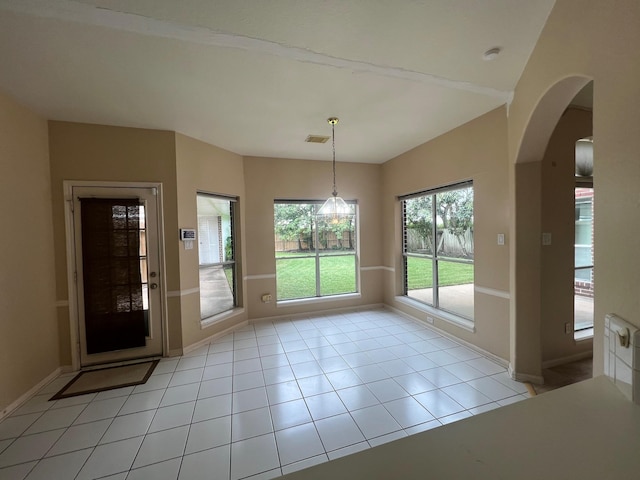 doorway to outside featuring light tile patterned floors