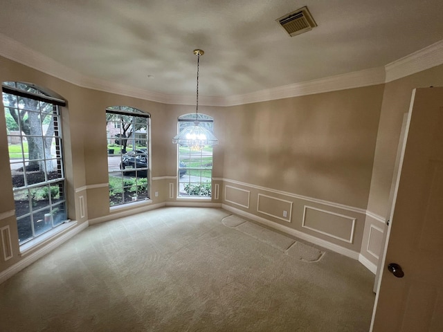 interior space featuring crown molding, a chandelier, and carpet flooring