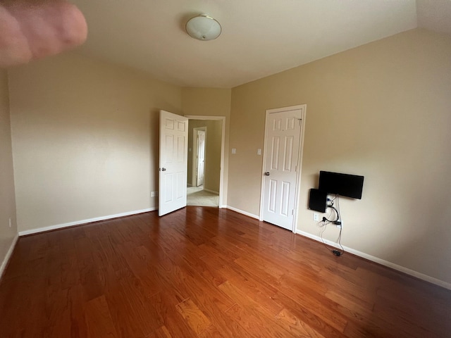 spare room featuring hardwood / wood-style flooring