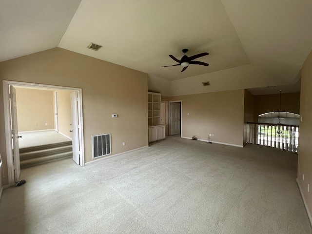 interior space featuring ceiling fan and vaulted ceiling