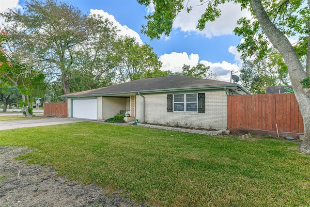 single story home with a front yard and a garage