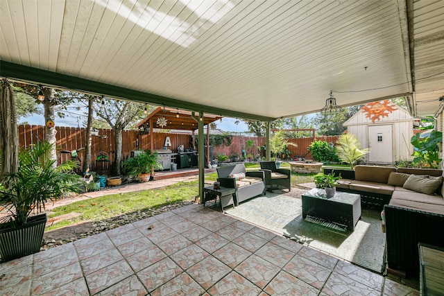 view of patio / terrace featuring an outdoor living space and a storage unit