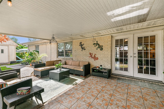 view of patio with french doors, a shed, and outdoor lounge area