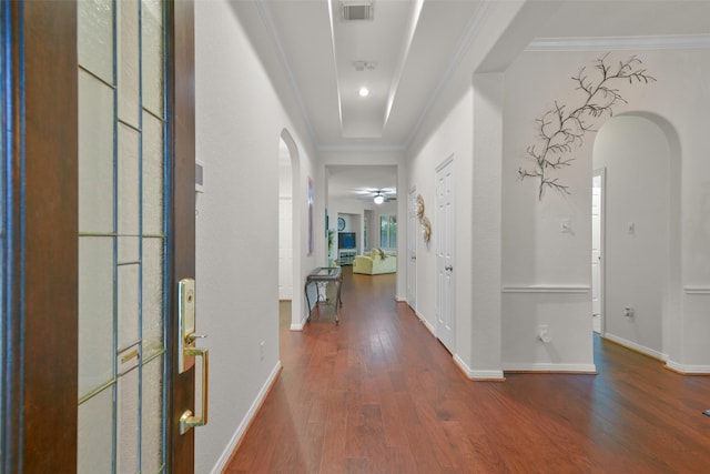 hallway featuring dark wood-type flooring and ornamental molding