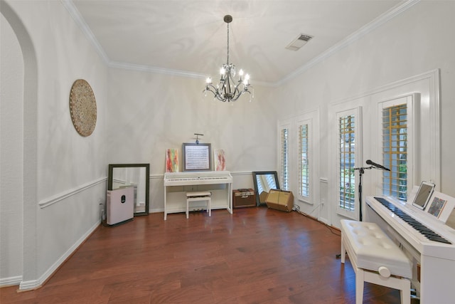 miscellaneous room featuring dark hardwood / wood-style floors, crown molding, and a notable chandelier