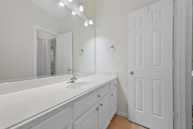 bathroom featuring tile patterned flooring and vanity