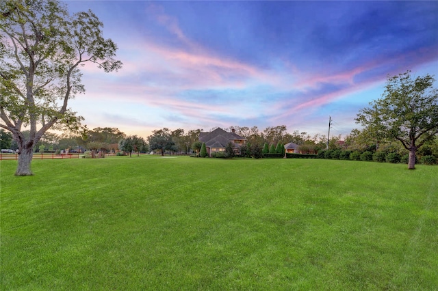 view of yard at dusk