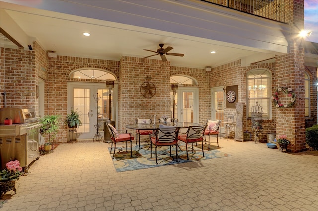 view of patio / terrace with ceiling fan and french doors