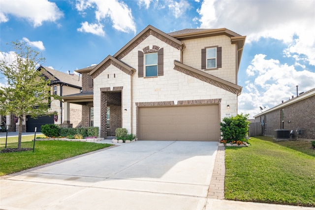 view of front of property featuring a front lawn and a garage