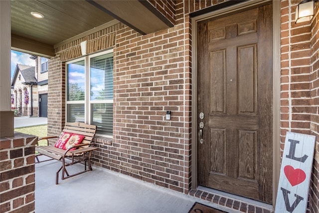 property entrance featuring covered porch