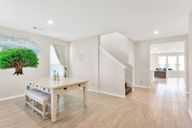 dining room with light wood-type flooring