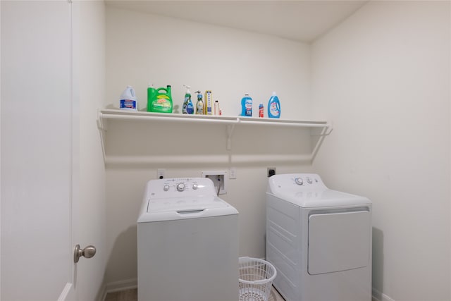 laundry room featuring washing machine and clothes dryer