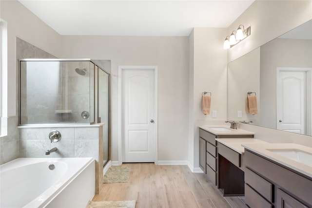 bathroom featuring vanity, shower with separate bathtub, and hardwood / wood-style flooring