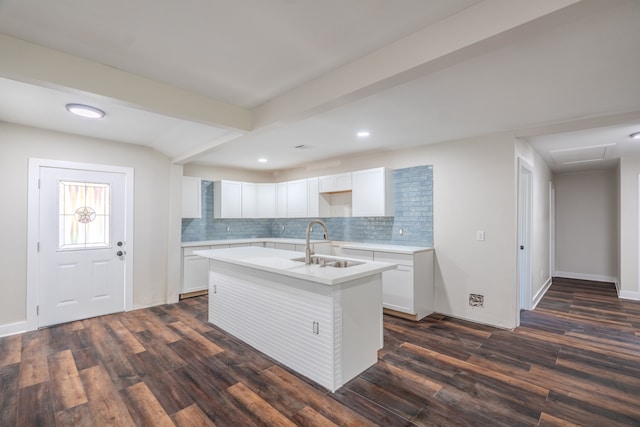 kitchen featuring white cabinetry, dark hardwood / wood-style flooring, a kitchen island with sink, and sink