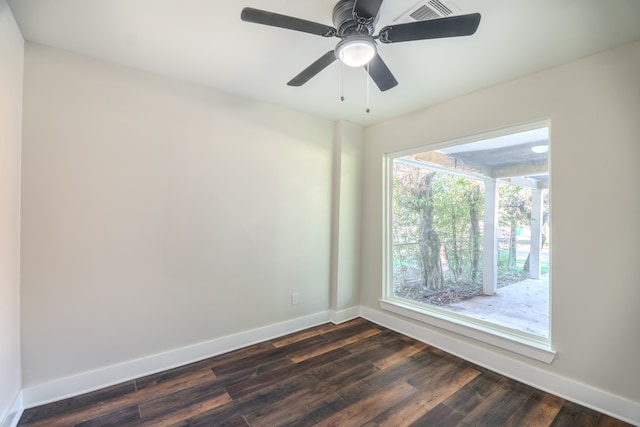 empty room featuring ceiling fan and dark hardwood / wood-style flooring