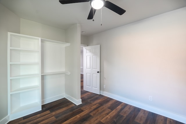 unfurnished bedroom with dark hardwood / wood-style floors and ceiling fan