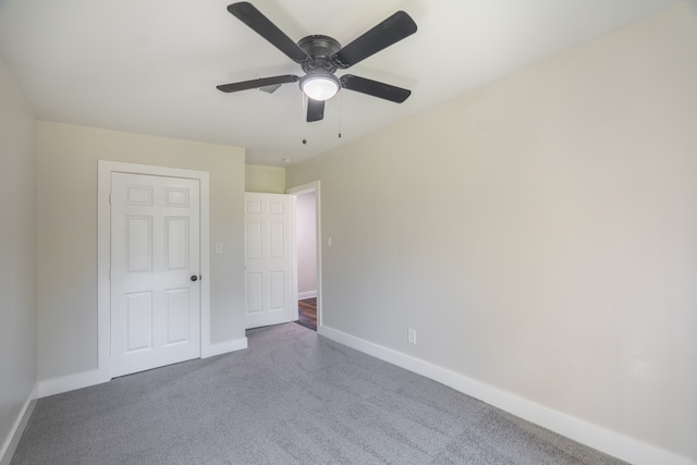 unfurnished bedroom featuring ceiling fan and carpet floors