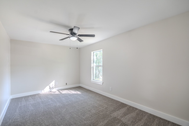 empty room with carpet flooring and ceiling fan