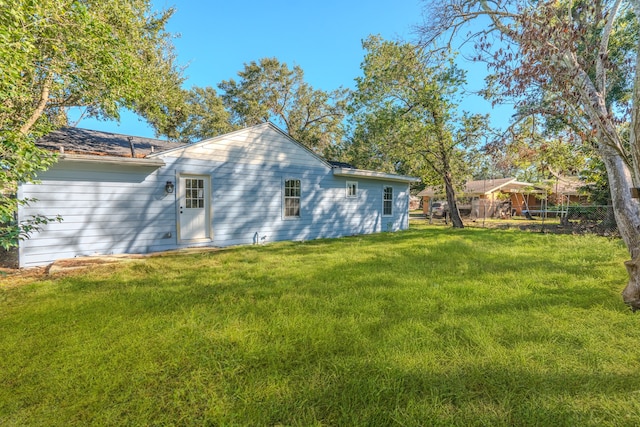 view of side of property featuring a yard