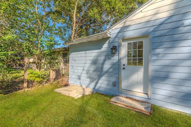 view of outbuilding with a lawn