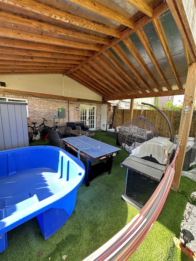 exterior space featuring a yard and grilling area