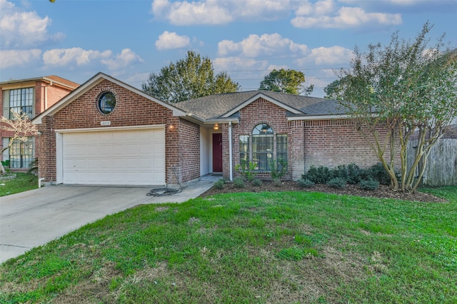 single story home with a front yard and a garage