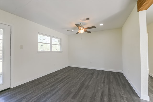 empty room featuring dark hardwood / wood-style floors and ceiling fan