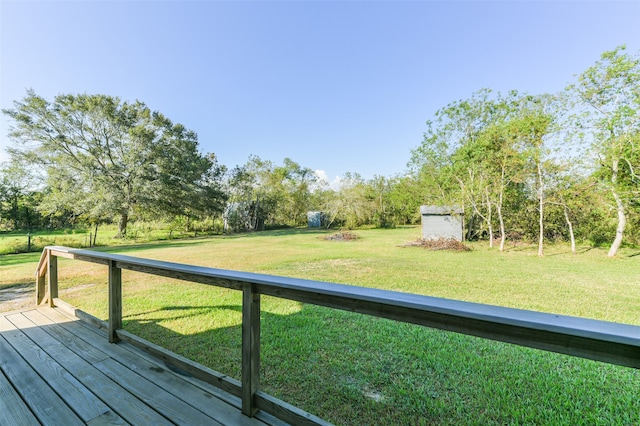 wooden terrace with a yard