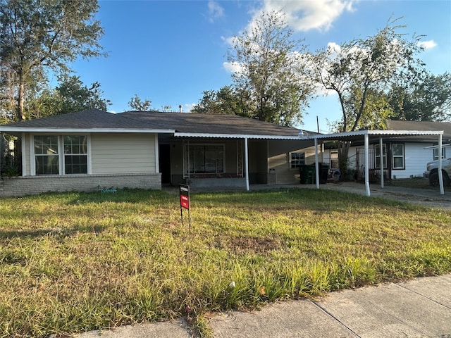 back of property with a lawn