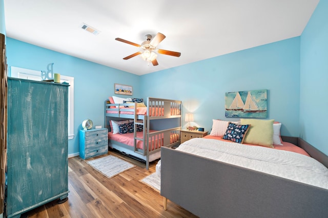 bedroom with wood-type flooring and ceiling fan