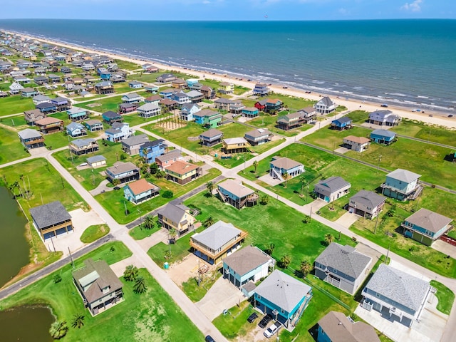 aerial view featuring a water view and a beach view