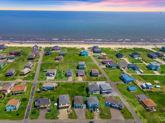 aerial view at dusk with a water view