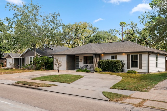 single story home featuring a front yard and a garage