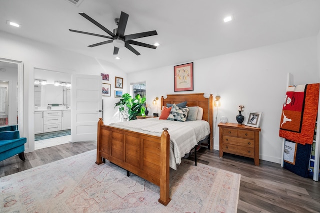 bedroom featuring connected bathroom, lofted ceiling, hardwood / wood-style floors, and ceiling fan