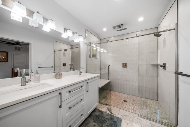 bathroom featuring vanity, ceiling fan, and a shower with shower door