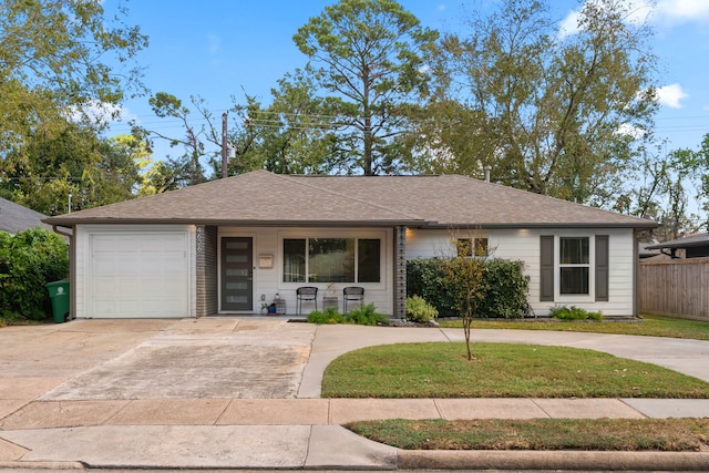 ranch-style home with a front yard and a garage