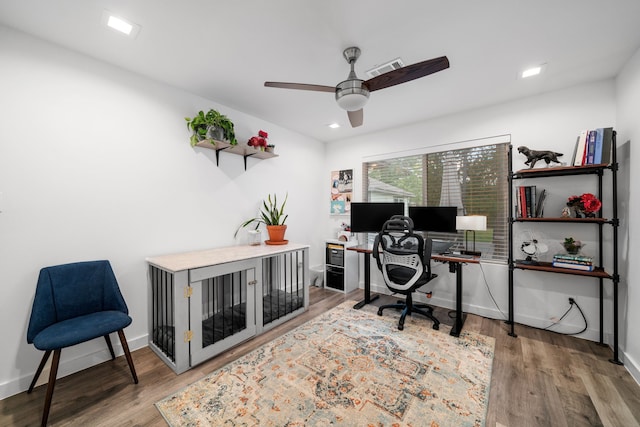 office area with ceiling fan and wood-type flooring