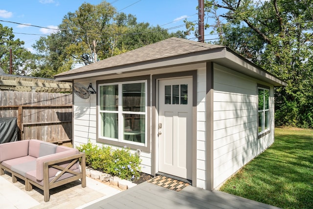 view of outdoor structure with a lawn