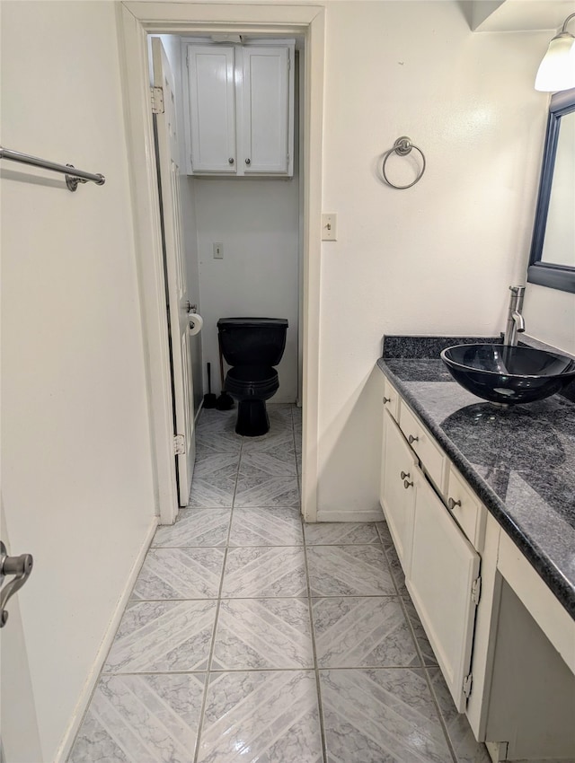 bathroom with vanity and toilet